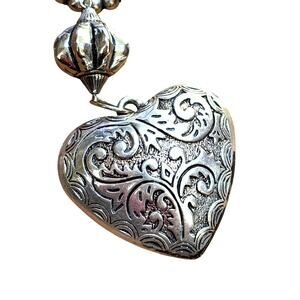 Puffy silver dangling textured heart pendant on silver ring vintage inspired